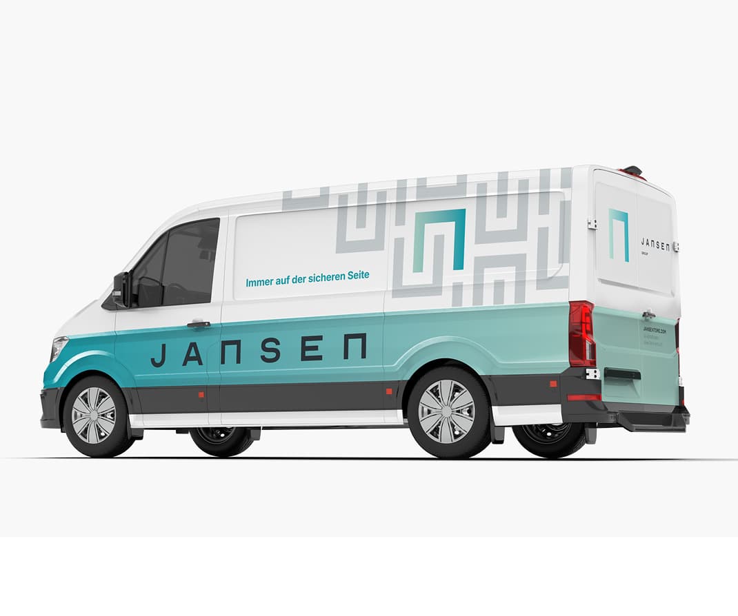 White and teal van with geometric patterns, "JANSEN" logo, and German text "Immer auf der sicheren Seite" on the side.