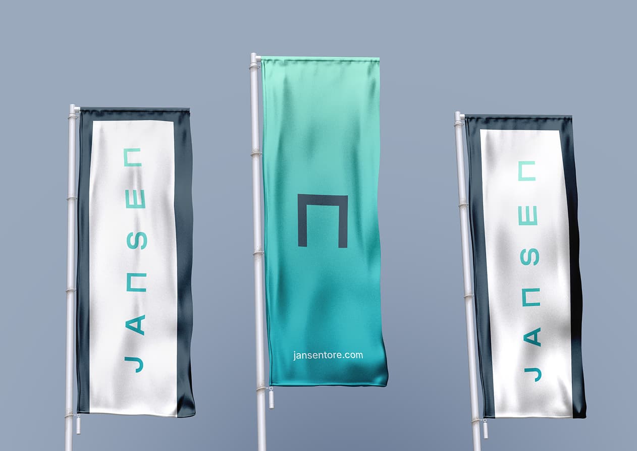 Three vertical flags on poles against a blue sky, featuring the text "JANSEN" and a logo on a teal background.