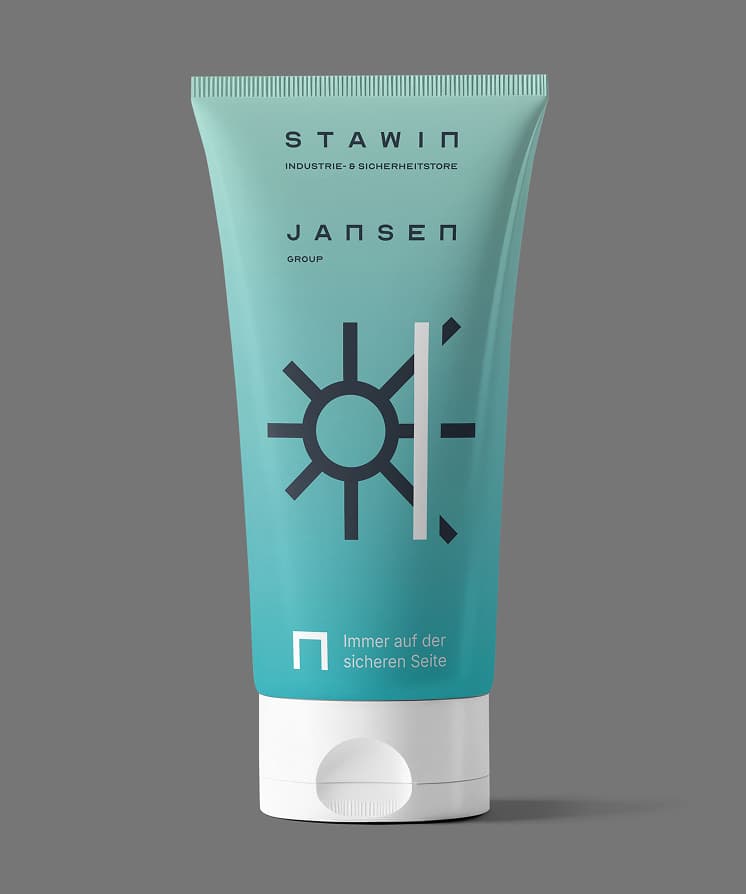 Teal tube of Stawin Jansen sunscreen with a sun and line graphic on a gray background. German text on the label.